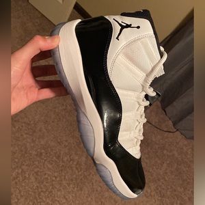 A couple little creases on the side. One little stain by the laces